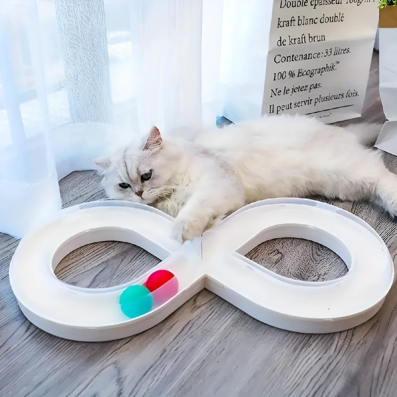 Blue and white cat activity centre with spinning track, ball, and teaser stick