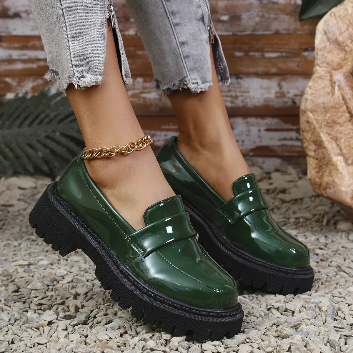 Black plus size women's loafers with a chunky platform heel and slip-on design.