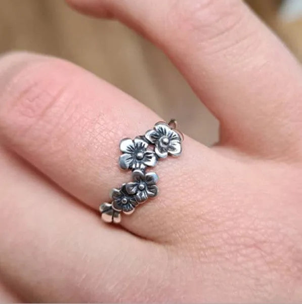 Antique silver alloy geometric ring with retro personality style on white background