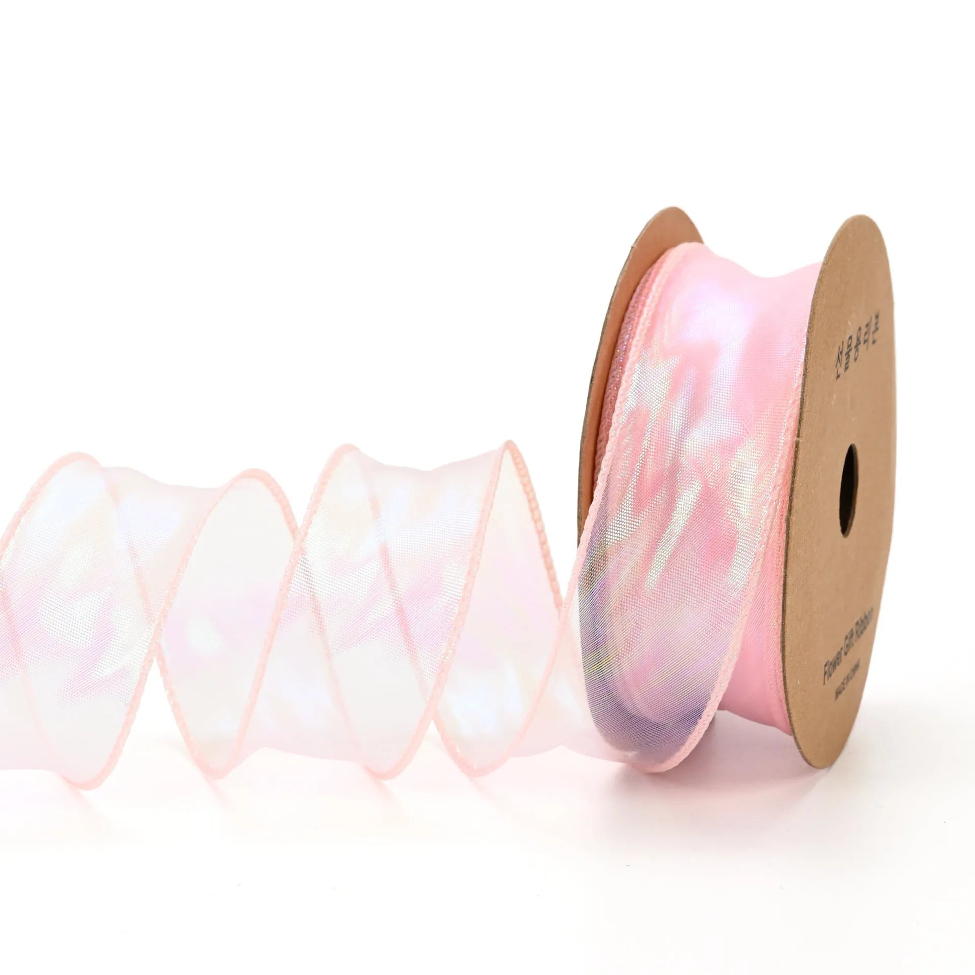 Roll of colourful fishtail yarn wave ribbon in mesh material, showing its textured, wave-like design.