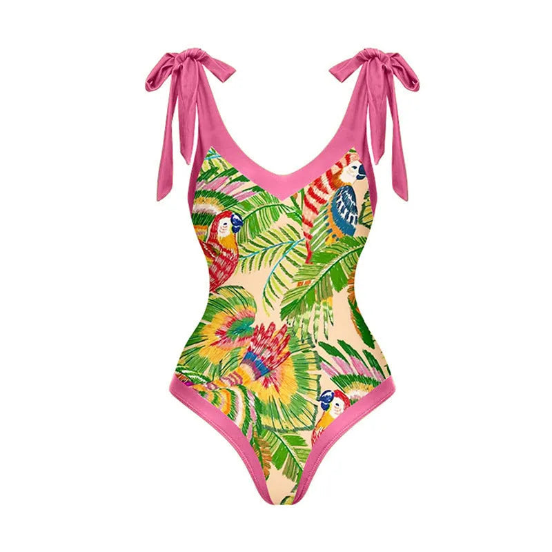 Retro pink floral print one-piece swimsuit with V-neck, skirt, and backless design.
