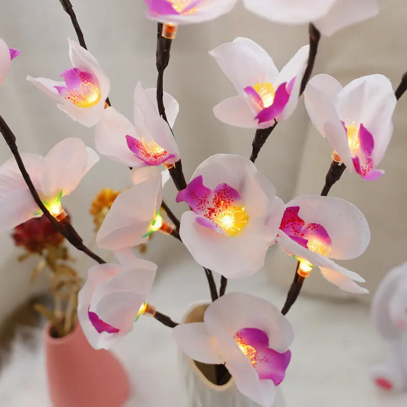 Pink LED phalaenopsis branch decorative light, 65 cm long, for indoor bedroom use.