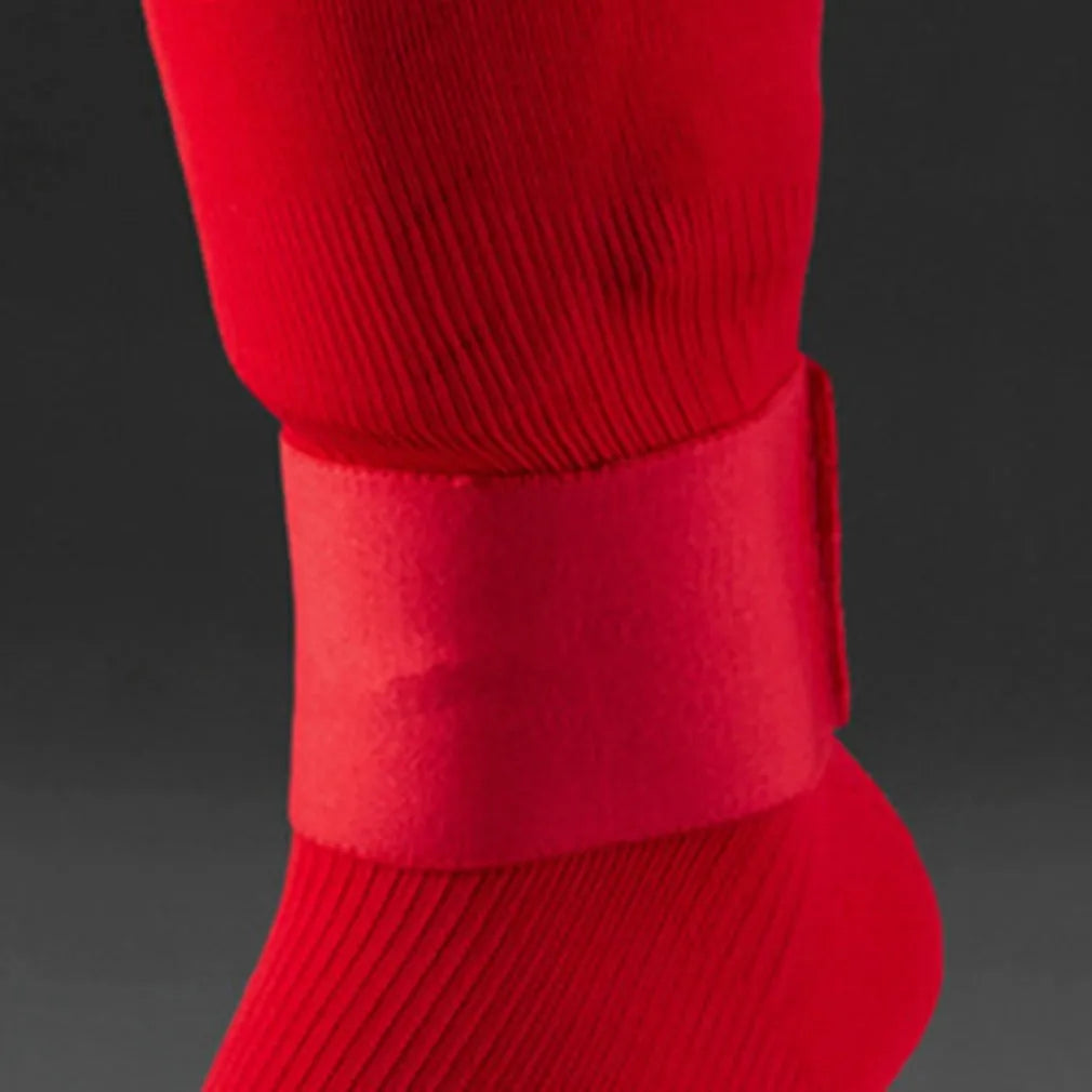Elastic rubber football shin guard fixing belt showing red, blue, black and white colour options