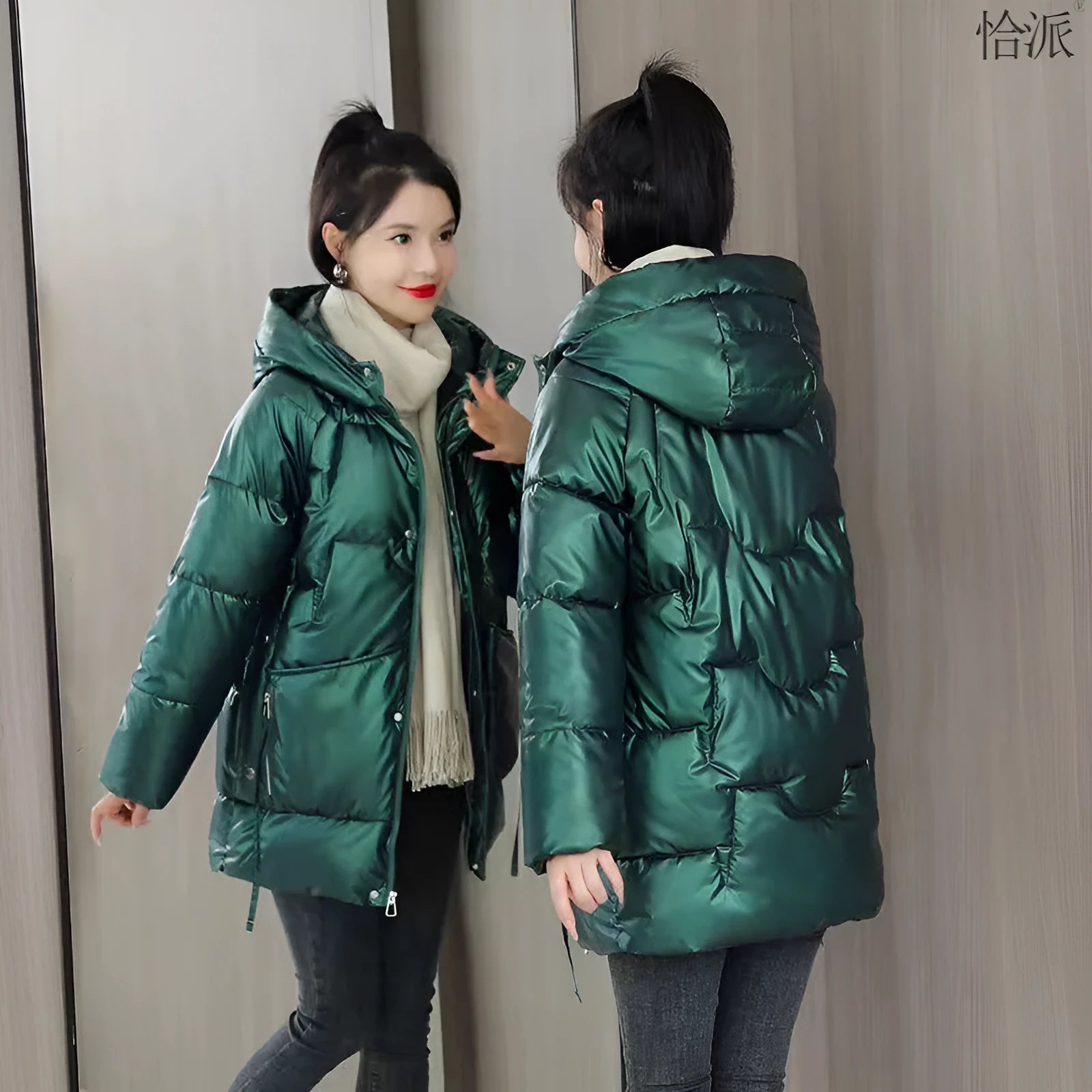 Women's loose-fit hooded winter jacket in blue with thick cotton filling.