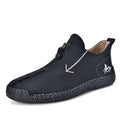 Men's brown leather-look zip-up ankle boots with hand-stitched detailing on a white background.