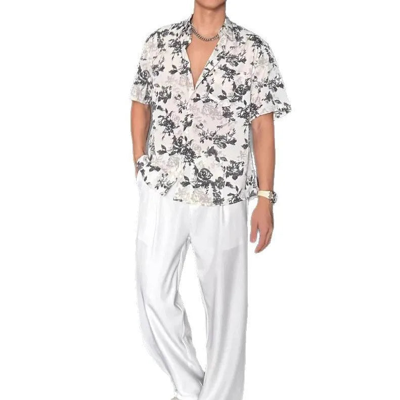 White loose-fit short sleeve casual shirt with a floral print and an open cardigan style front.