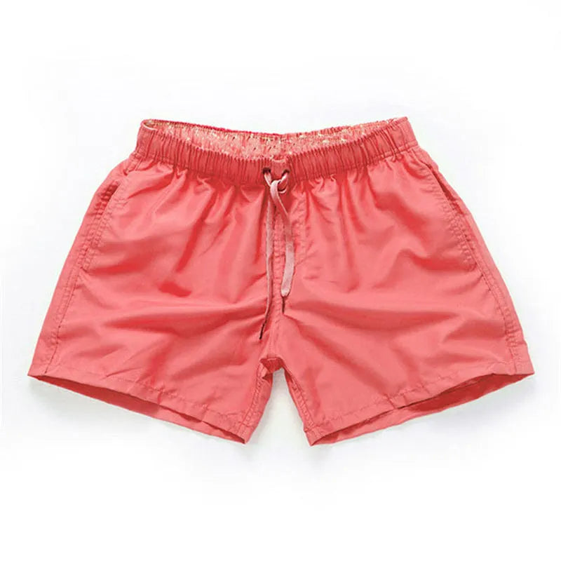 Men's straight leg beach shorts in polyester fabric available in multiple colours and sizes