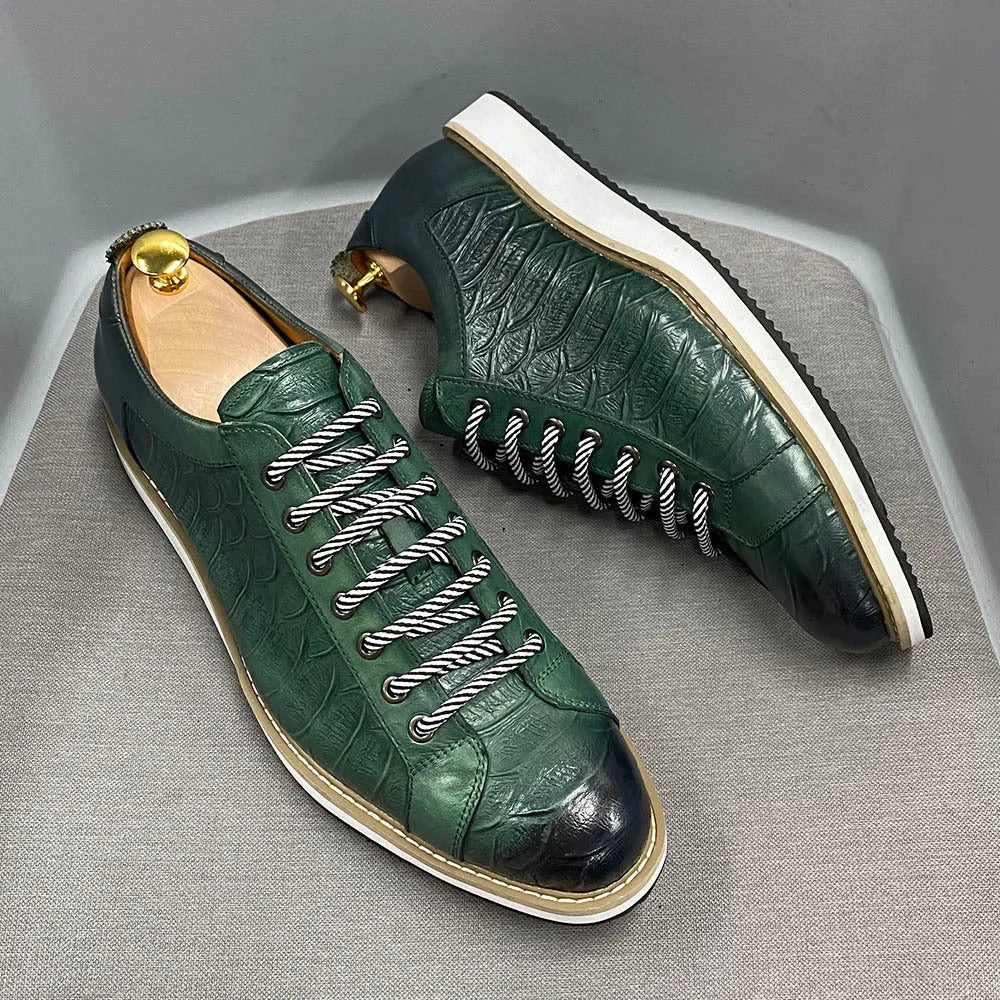 Men's low-top handmade shoes with an embossed pattern and front tie laces.