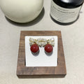 Silver needle micro inlaid zircon bow pearl drop earrings on a light background