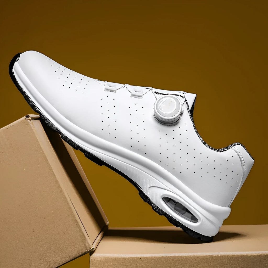 Men's low top black mesh casual shoes with white composite sole and cross shoulder straps.
