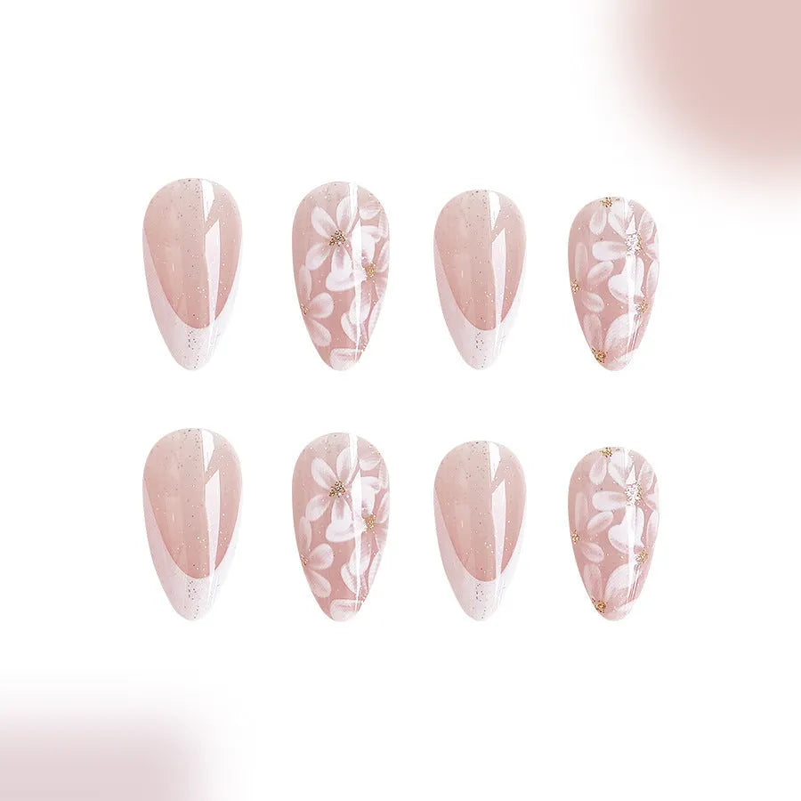 Short glossy almond French style press-on nails with glittering powder flowers in colour C625