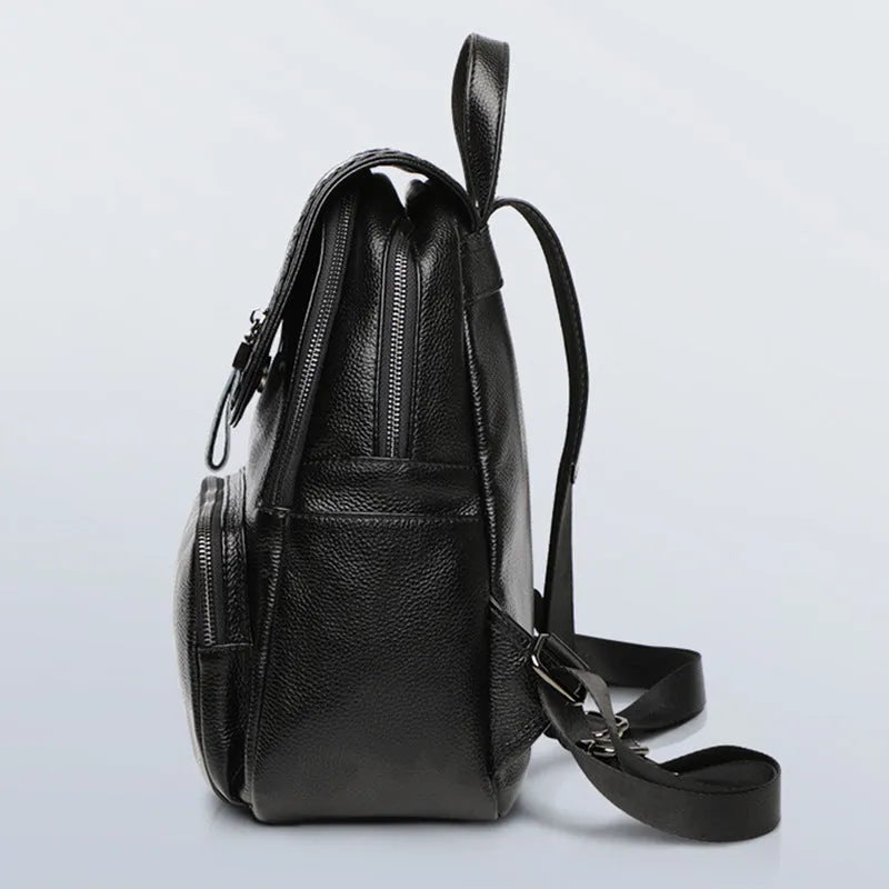 Blue genuine leather women's backpack with street style design showing internal organiser compartments