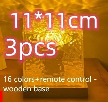 LED water ripple night light with rotating crystal projection and remote control on wooden surface