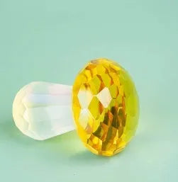Colourful geometric mushroom ornament made of white crystal in four colour options.