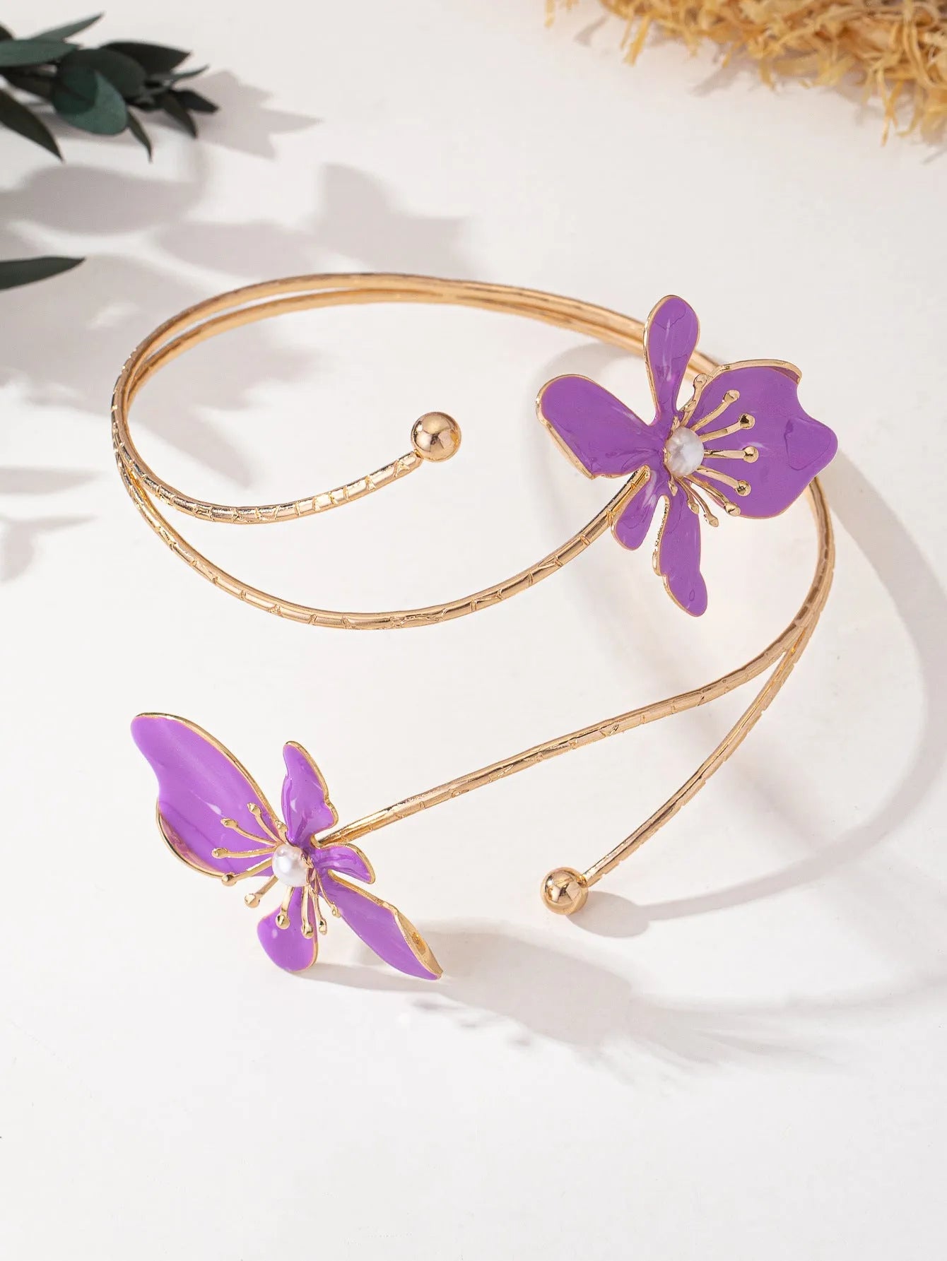 Pink personalised hollow pattern alloy armband open ring bangle on a wrist.