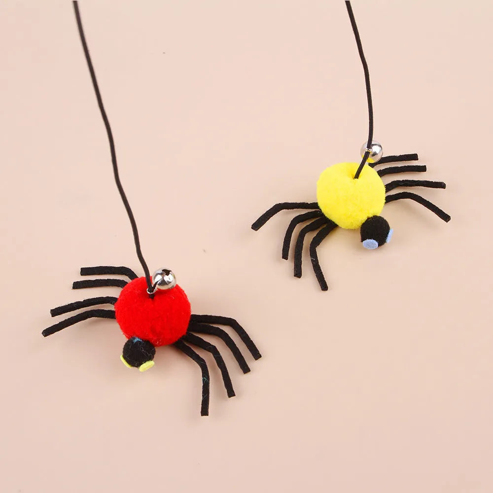 Hanging door cat toy with elastic rope, feather, bell and spider attachments in red or yellow colour