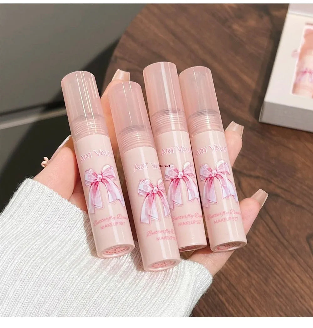Pink Butterfly Box makeup set with four lip muds, a powder blusher, and a necklace