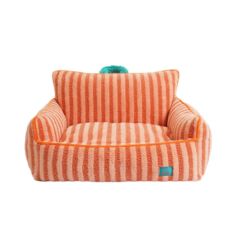 Striped orange plush dog bed with a removable cover on a wooden floor.
