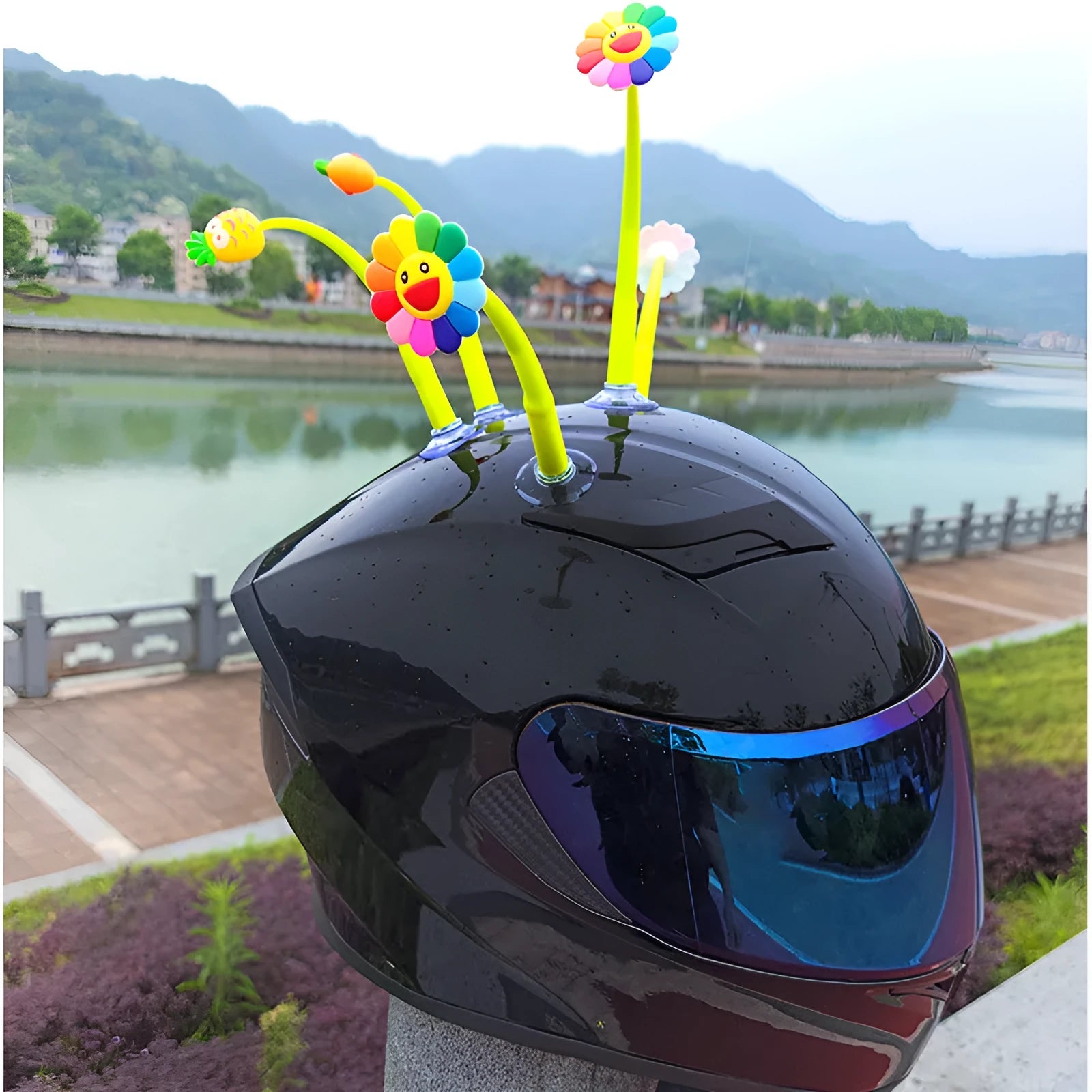 Yellow sunflower silicone decoration with a suction cup base for attaching to a helmet.