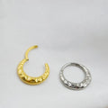 Titanium alloy ASTM F136 concave-convex nose ring in gold and silver colour options showing textured surface detail