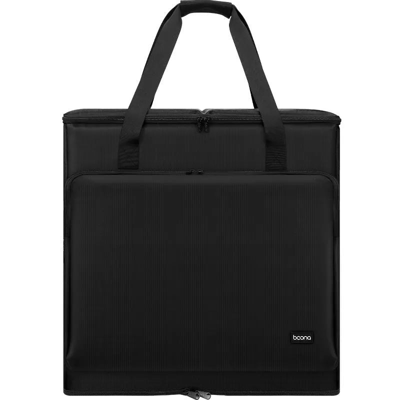 Black Oxford cloth desktop computer host storage bag holding a PC tower and 27-inch display