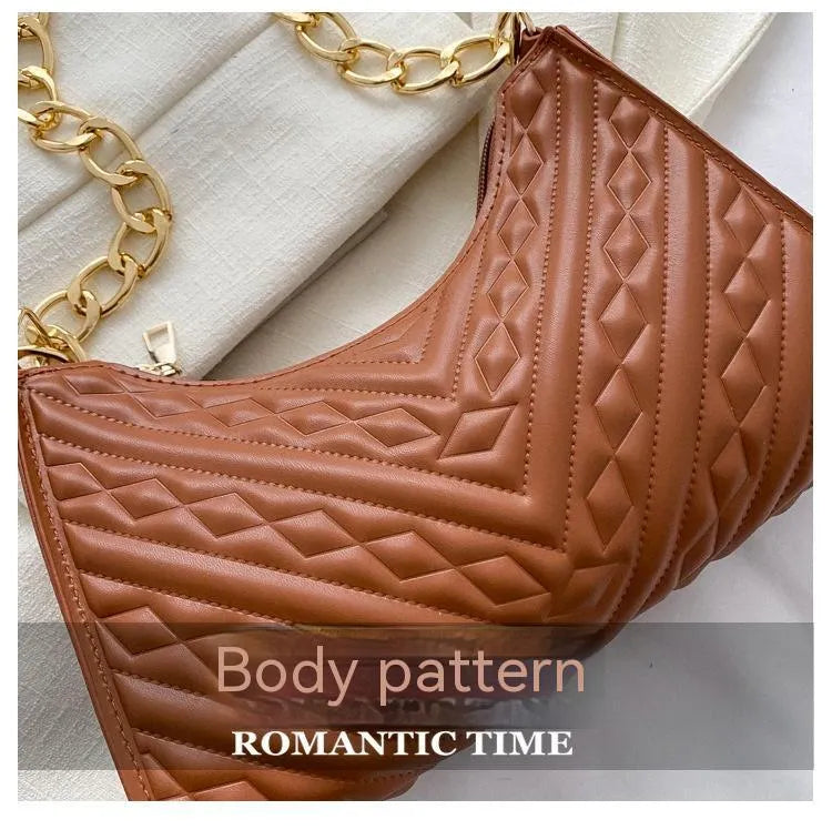 Vertical brown PU leather women's shoulder bag with a pleated front, chain strap, and soft handle.