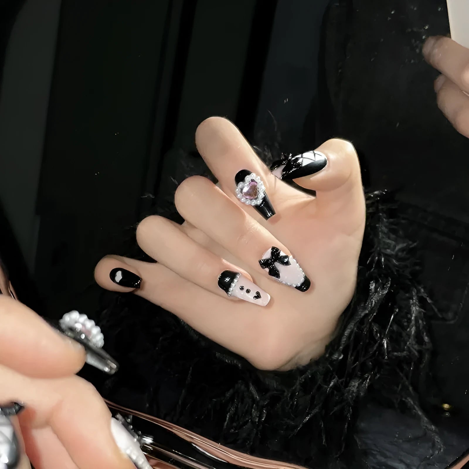 Hand-painted black pink heart design plastic nail armour set in four sizes