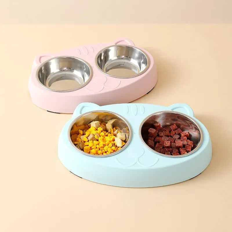 Blue macaron-shaped plastic pet feeder with two bowls for food and water