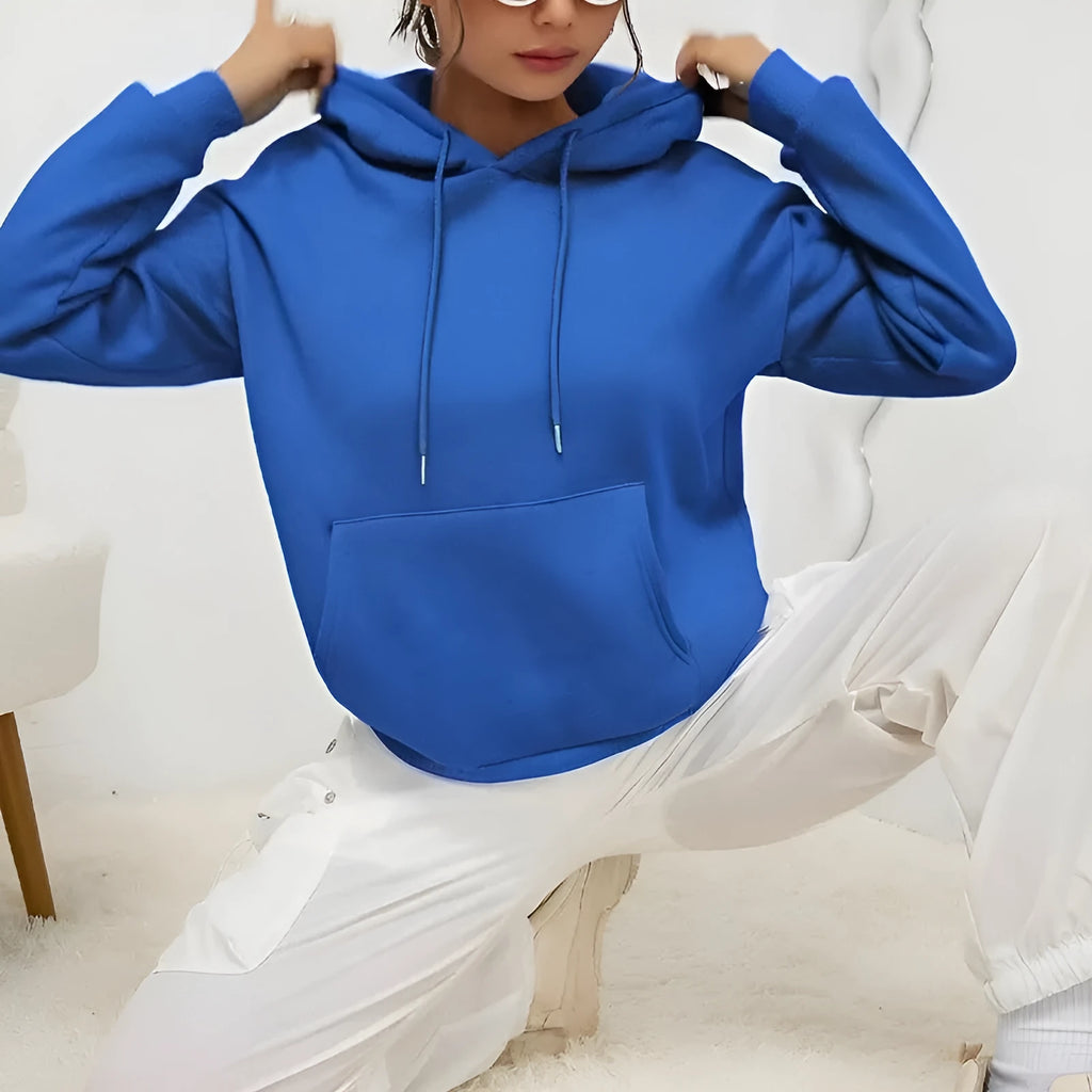 Women's loose grey sweatshirt with long sleeves and a front drawstring pocket.