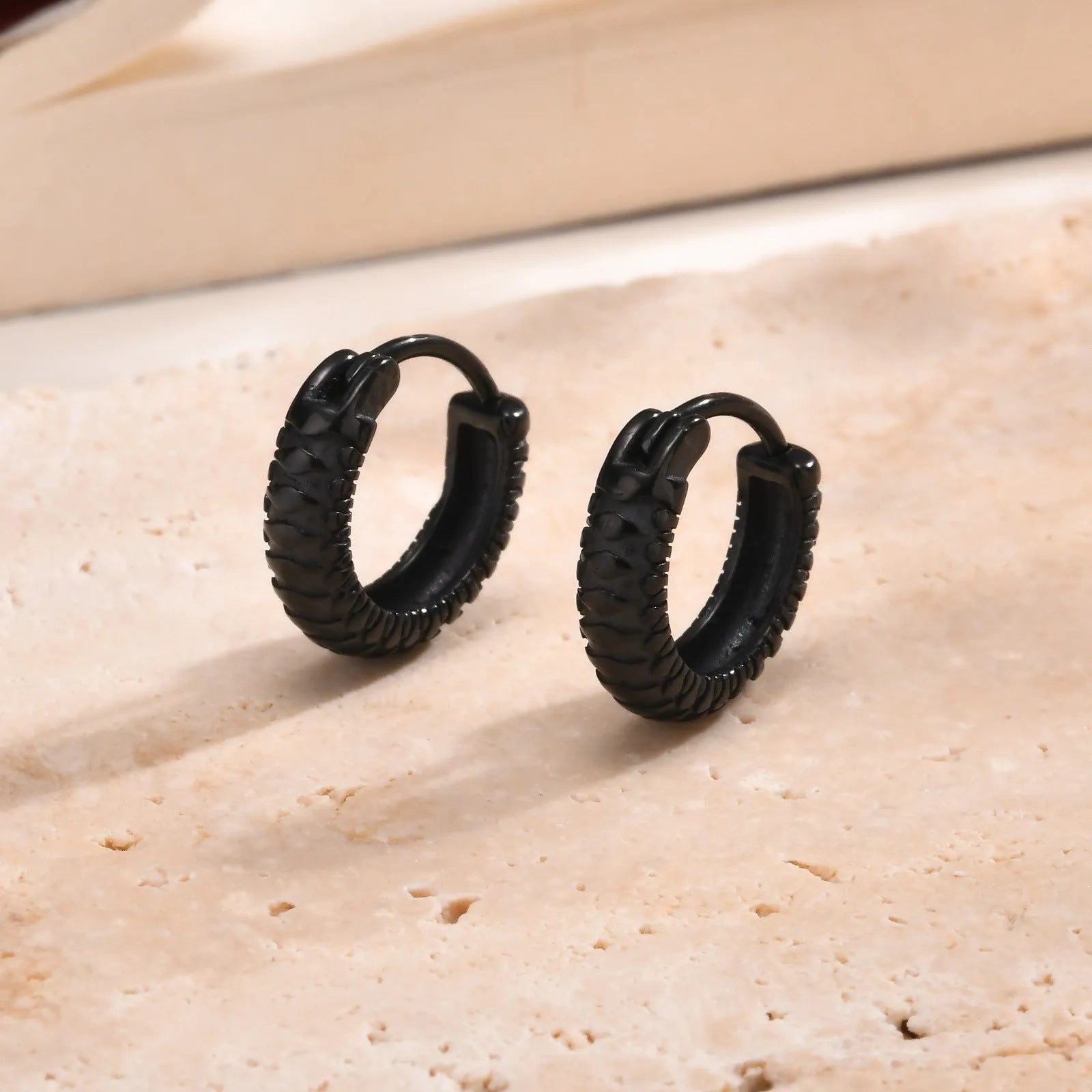 Stainless steel snake pattern earrings for men in black and gold finishes