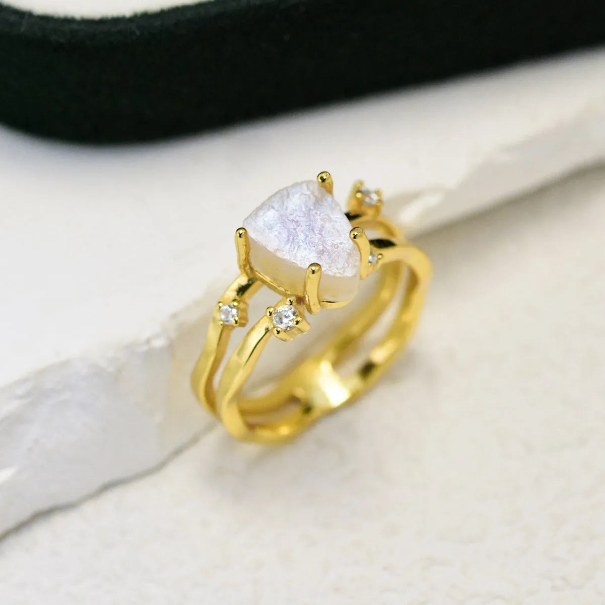 S925 sterling silver ring with irregular triangle shape, moonstone, and electroplated rose gold finish.