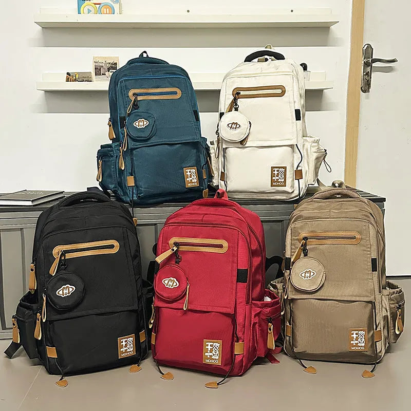 Japanese leisure travel backpack in black with contrast stitching and 20-35 litre capacity