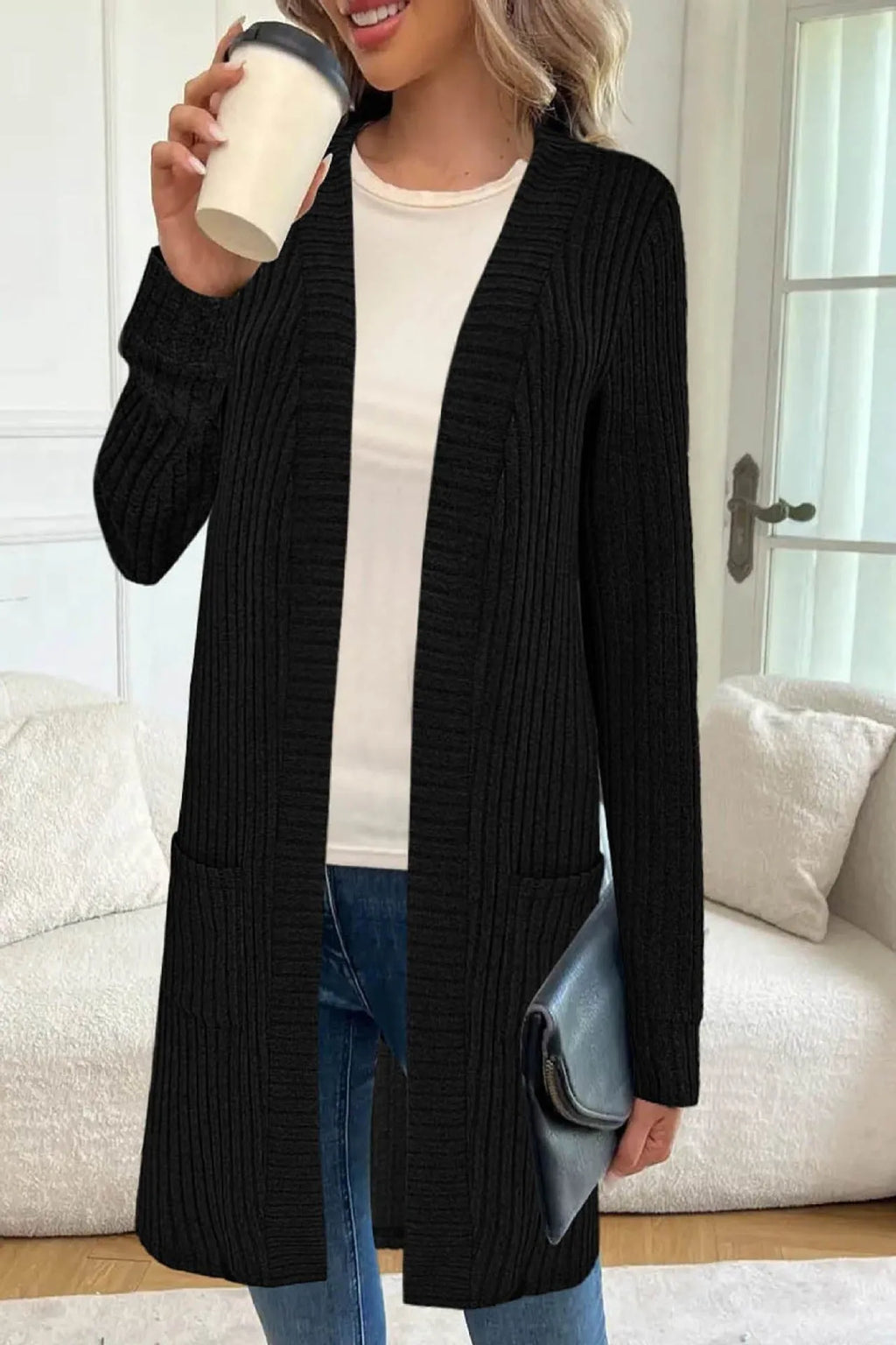 Long sleeve loose fit cardigan jacket with pockets in polyester fabric shown in black colour