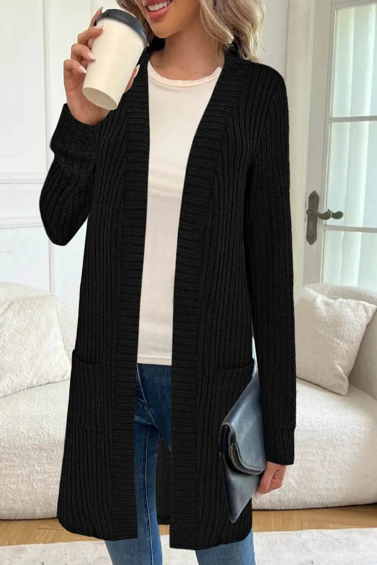 Long sleeve loose fit cardigan jacket with pockets in polyester fabric shown in black colour
