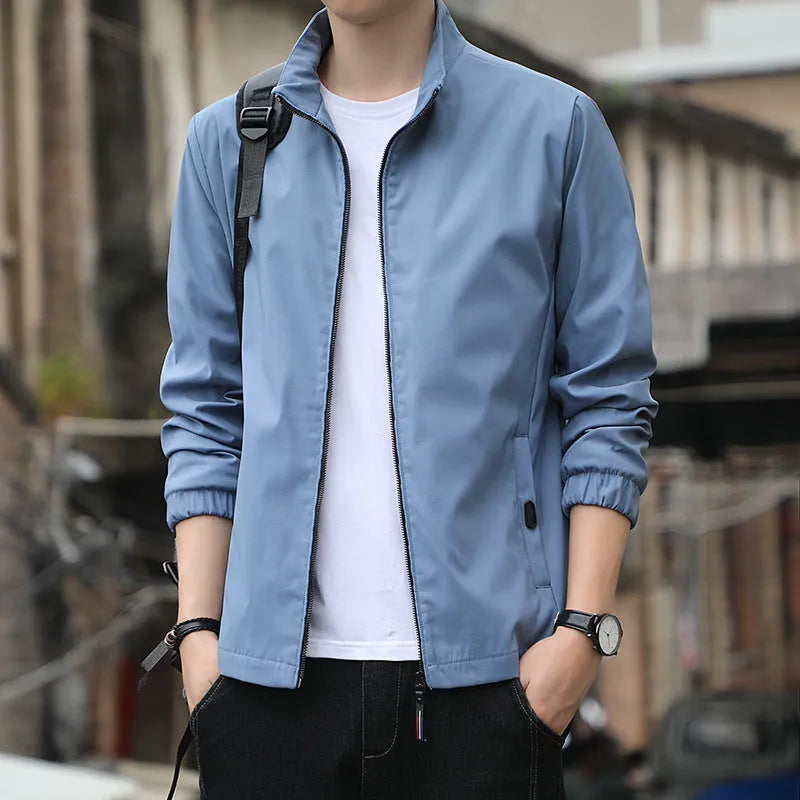 Men's Korean style loose lapel casual jacket in blue with zipper pockets.