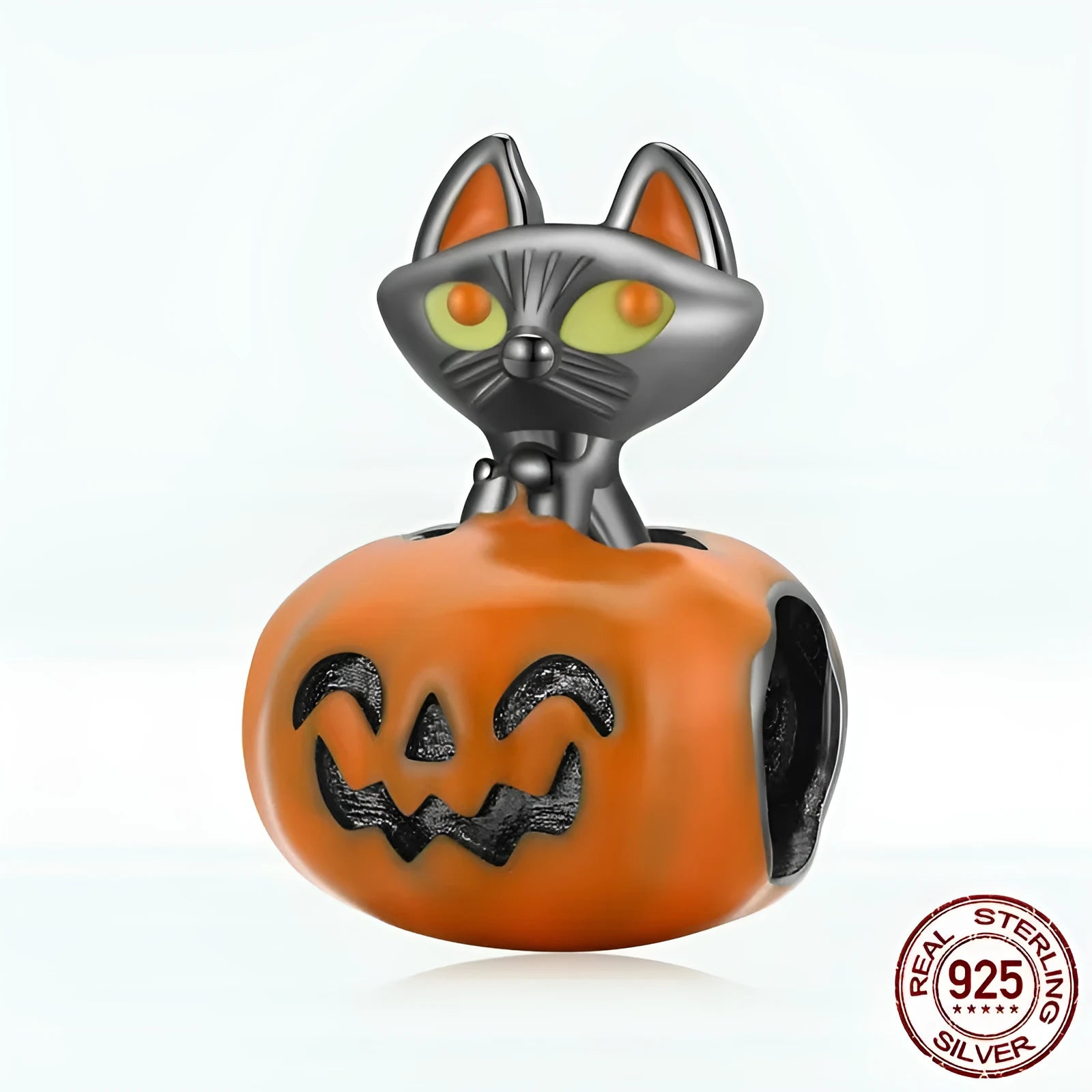 Close-up of sterling silver pumpkin black cat pendant with black gold plated oil dripping finish