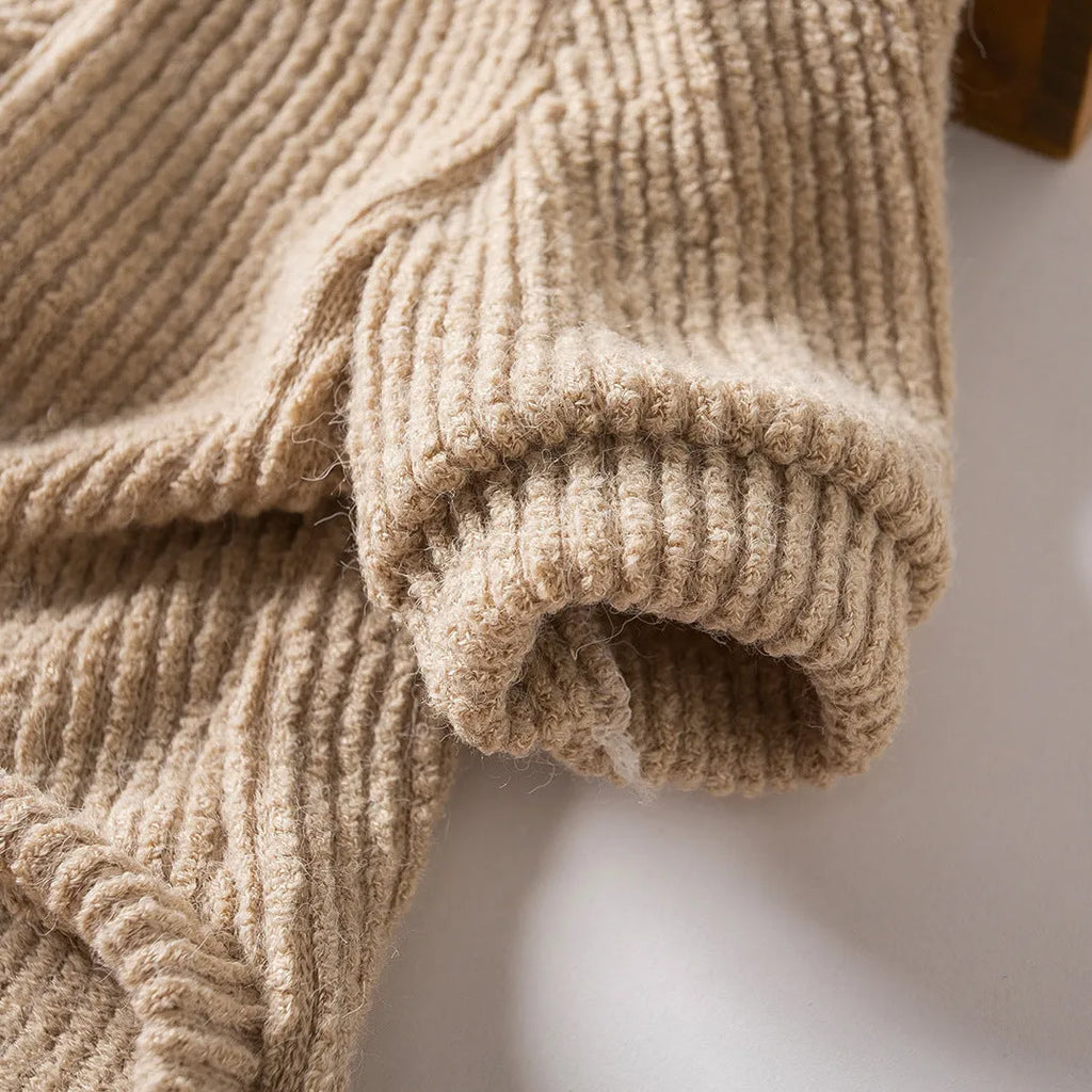 Brown knitted cloth pullover sweater on a small dog, showing casual style.