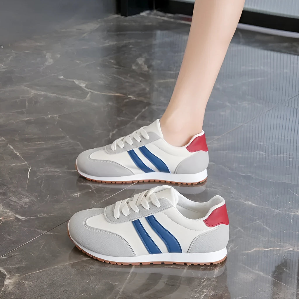 Blue and grey Cortez stripes casual sports shoes with round toe and flat rubber sole.