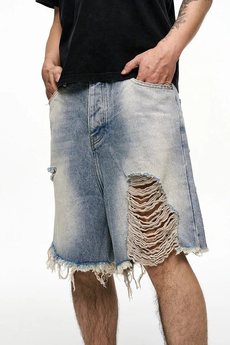 Men's light blue retro washed baggy denim shorts on a hanger