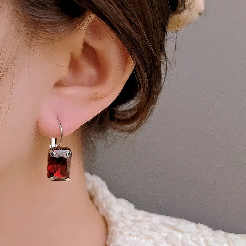 Square crystal fashion earrings in copper with red, yellow, and purple colour options