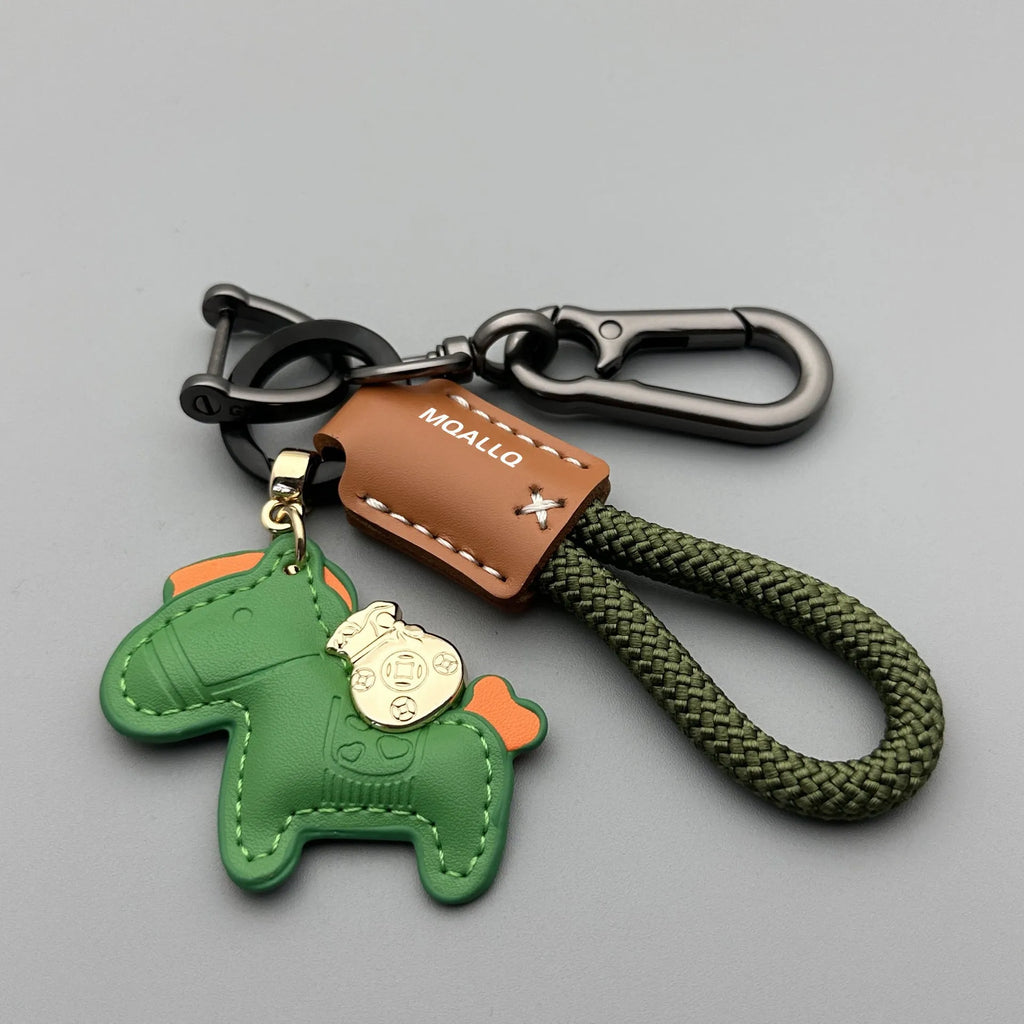 Handmade brown cowhide leather keychain with a silver pony belt buckle charm and green velvet rope.