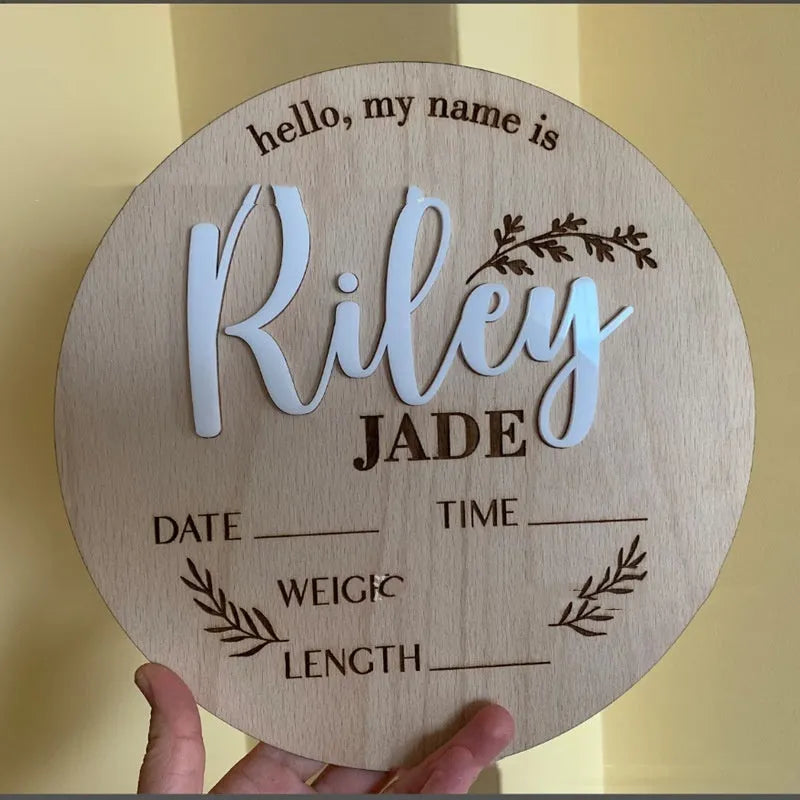 Square plywood newborn name label showing baby birth information, 15cm wide.