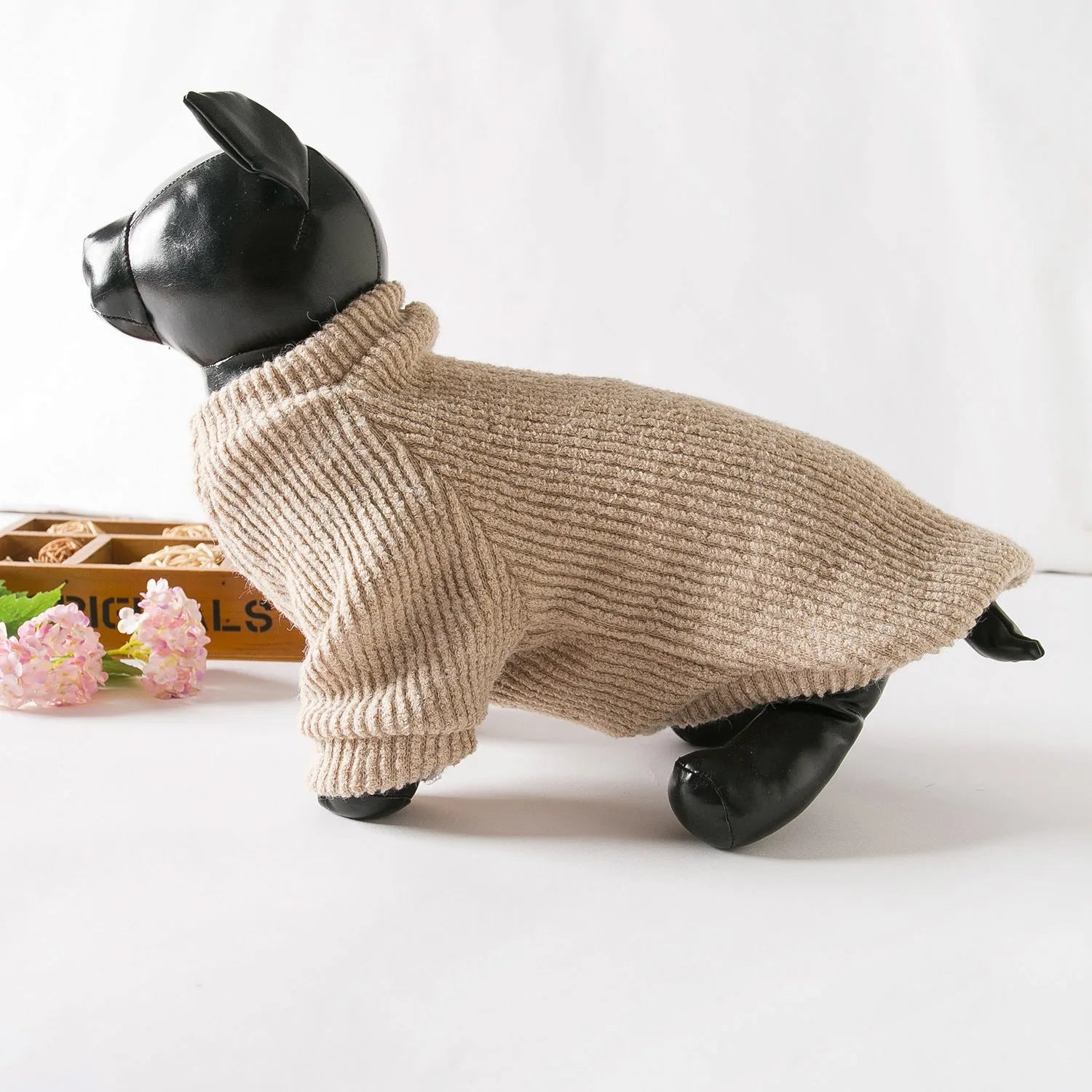 Brown knitted cloth pullover sweater on a small dog, showing casual style.