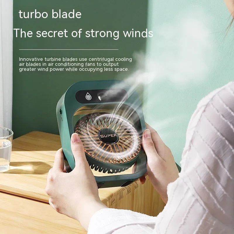 Green and white USB portable misting fan air cooler humidifier on a desk