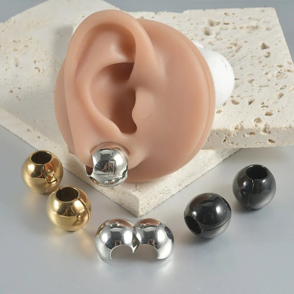 Stainless steel hollow skull Buddha head geometric earrings in four colour options.
