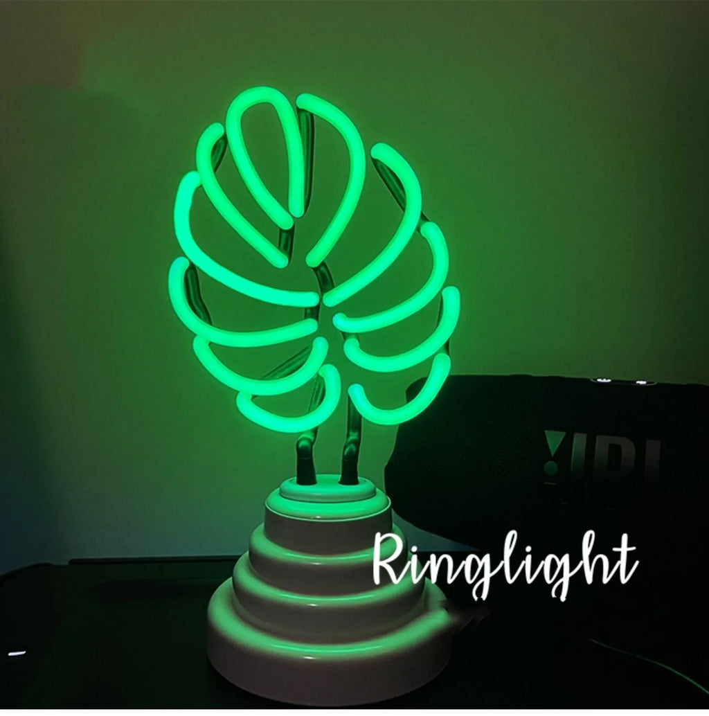 Handmade white bamboo-shaped desk lamp emitting green light, shown in two size options.