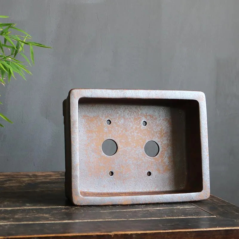 Rectangular purple sand bonsai pot with rustic firewood texture, shown empty for scale.