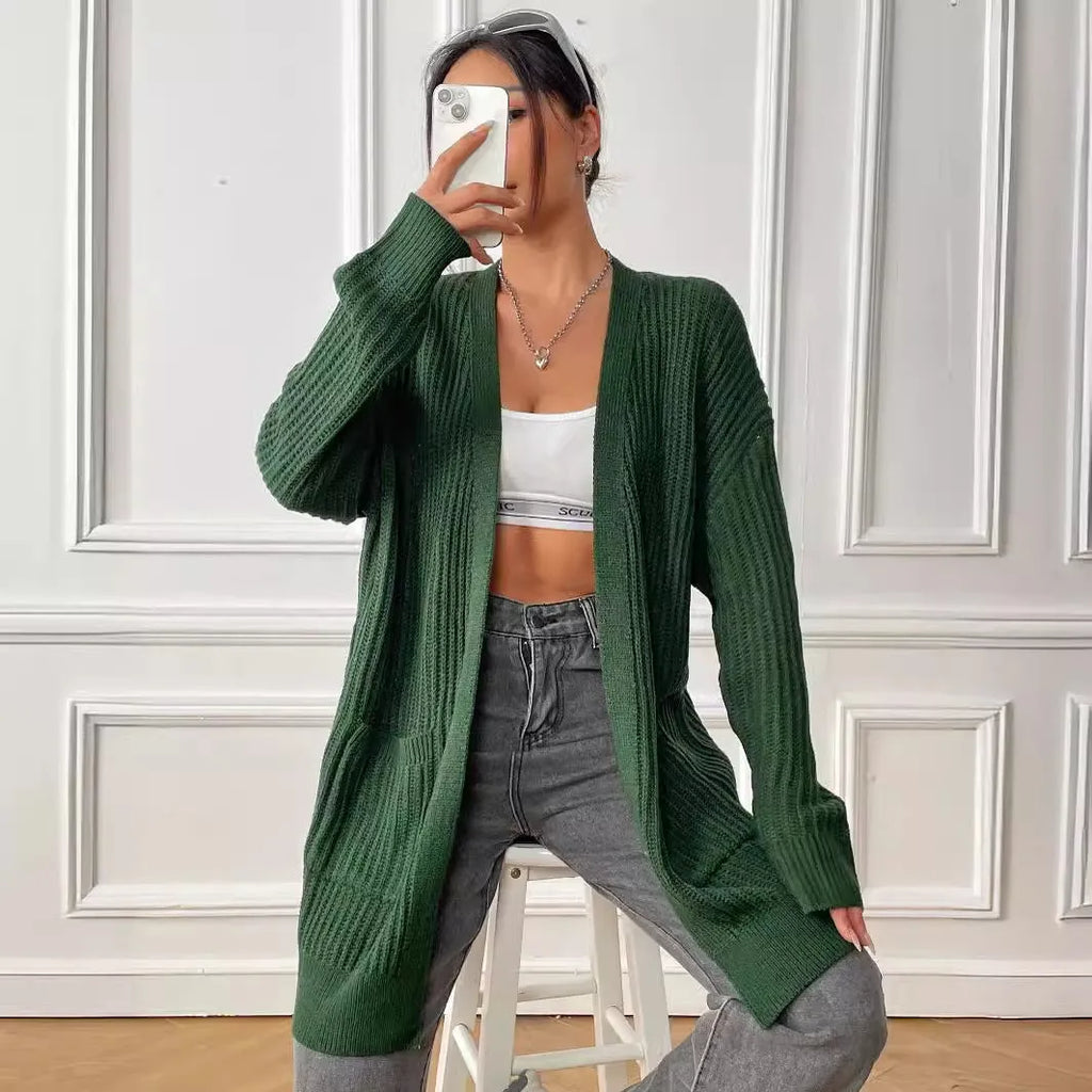 Dark green women's loose-fit acrylic cardigan with two pockets and long sleeves.