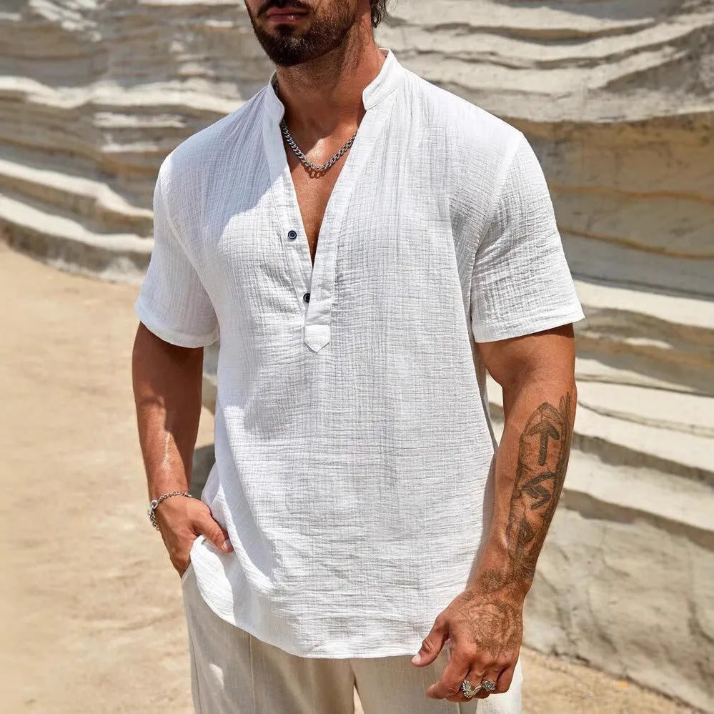 Man wearing a light blue stand collar short-sleeved casual shirt for summer.