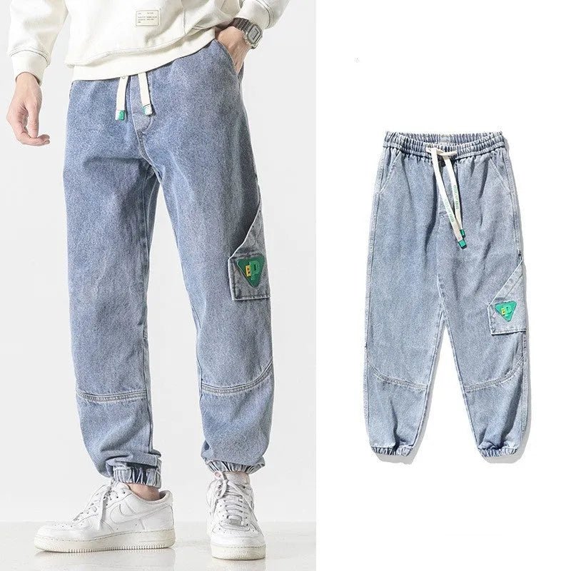 Men's loose-fit tapered cotton trousers in black, blue, and grey colours with mid waist design